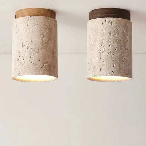 Two cylindrical concrete ceiling lights with wooden caps in light and dark wood from kaku light collection