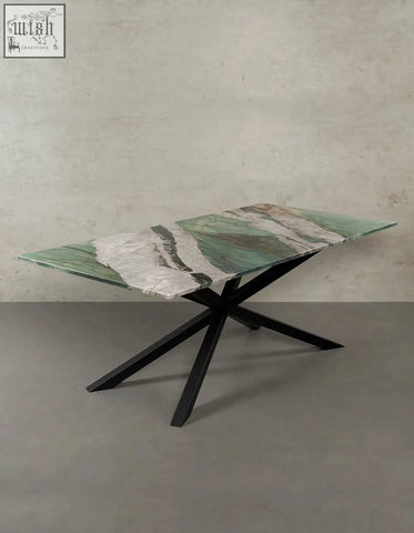 Kamara dining table with a sleek green and white marble dining table top and modern black metal x-shaped base