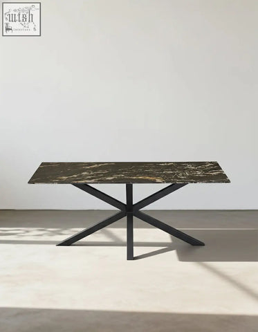 Kamara dining table with dark green and gold veined marble top and sleek black metal legs perfect as a marble dining table