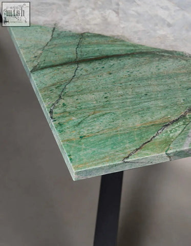 Kamara dining table with sleek green marble tabletop and black metal leg perfect for marble dining use