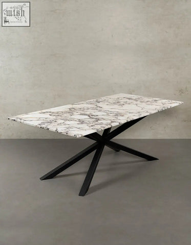 Kamara dining table with white marble top featuring gray veining and black metal x-shaped legs perfect for marble dining
