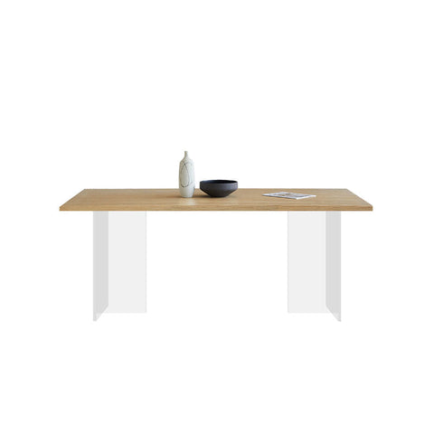 Kamaria dining table with a solid wood light oak top and sleek white acrylic legs perfect for modern dining spaces