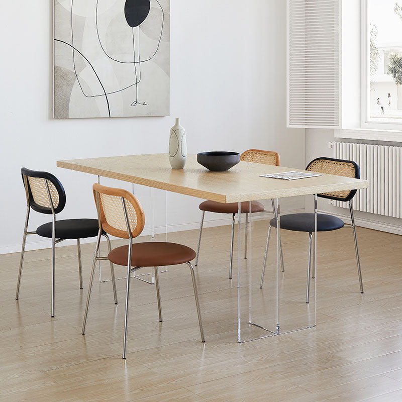 Modern kamaria dining table with solid wood light wood top and transparent acrylic legs for stylish dining areas