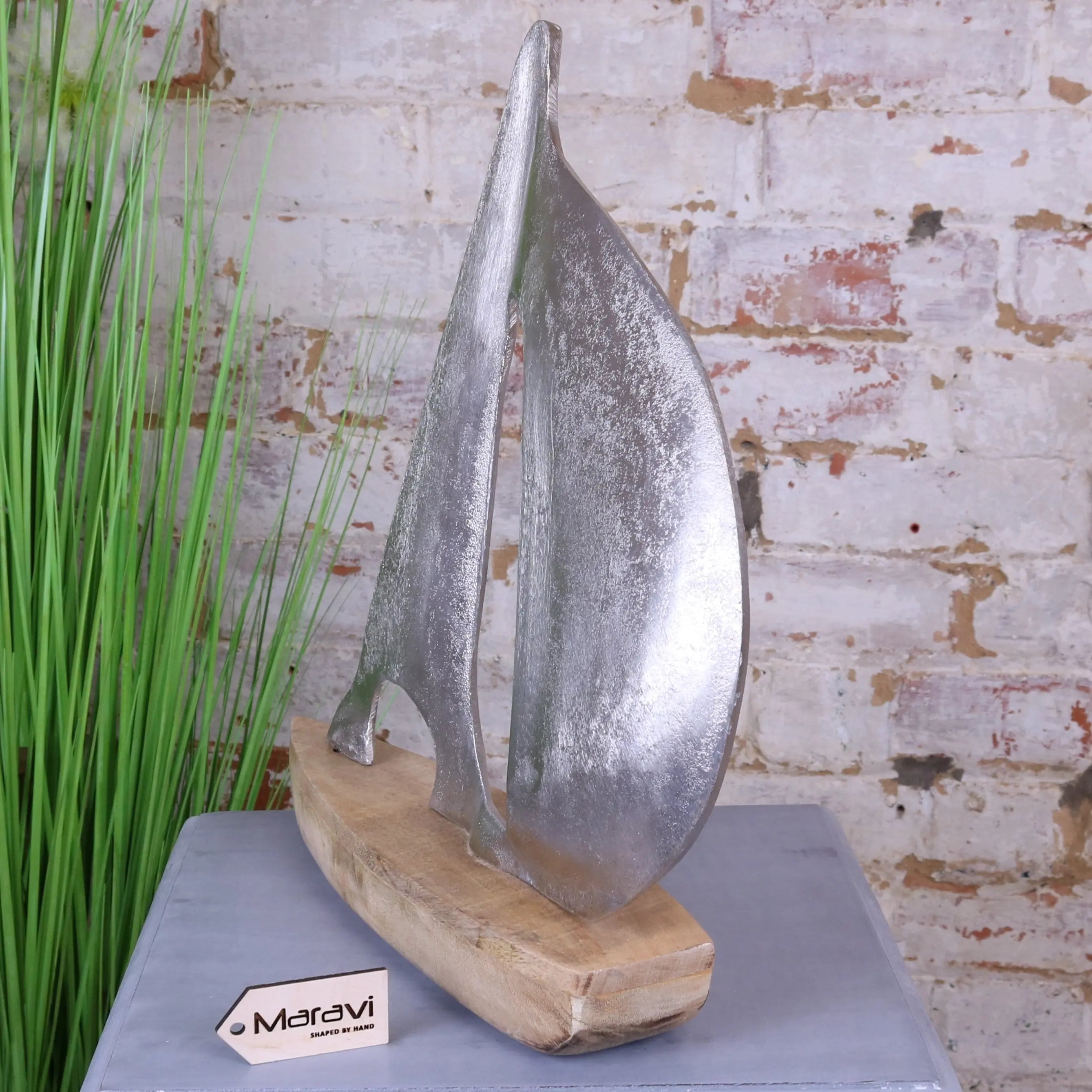 Silver metallic kasba boat ornament sailboat sculpture with rustic wooden base perfect for home decor
