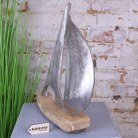 Silver metallic kasba boat ornament sailboat sculpture with rustic wooden base perfect for home decor