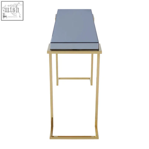 Kaso console table with a sleek grey top and slender gold stainless steel legs for a modern look