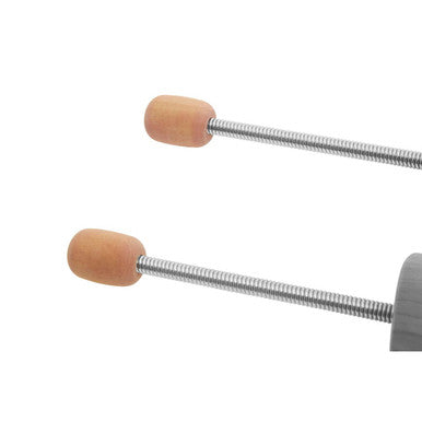 Silver metal screwdriver with tan rubberized handles next to kata pair of cedar wood men shoe shapers