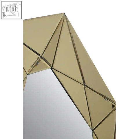 Geometric kava gold frame wall mirror with a gold-toned faceted frame made of mirrored glass panels