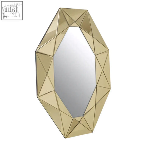 Kava gold frame wall mirror with gold tone geometric faceted frame resembling a cut gemstone gold frame wall piece