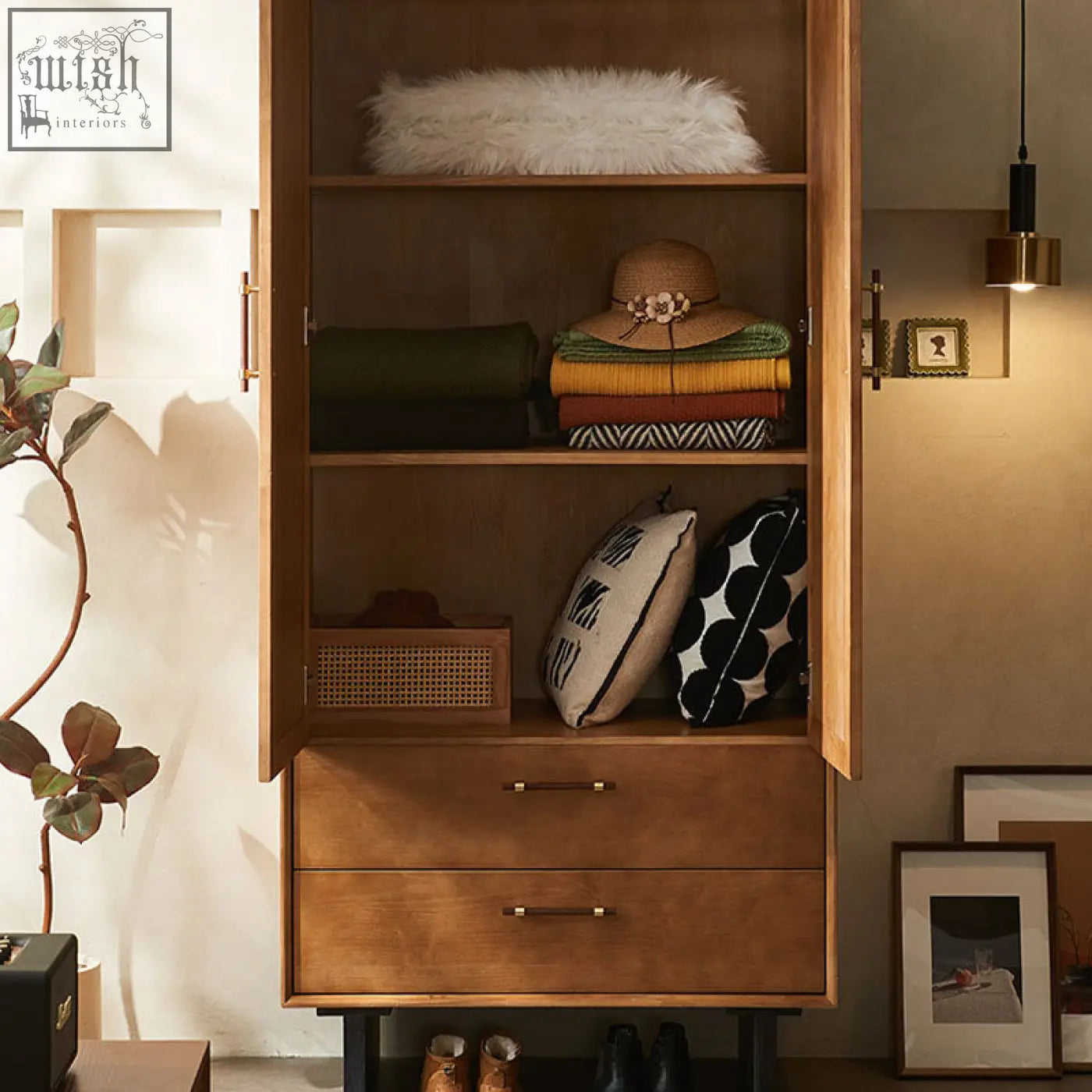 Warm-toned wooden kaylee rattan wardrobe with open shelves, two drawers, brass handles, and black metal legs
