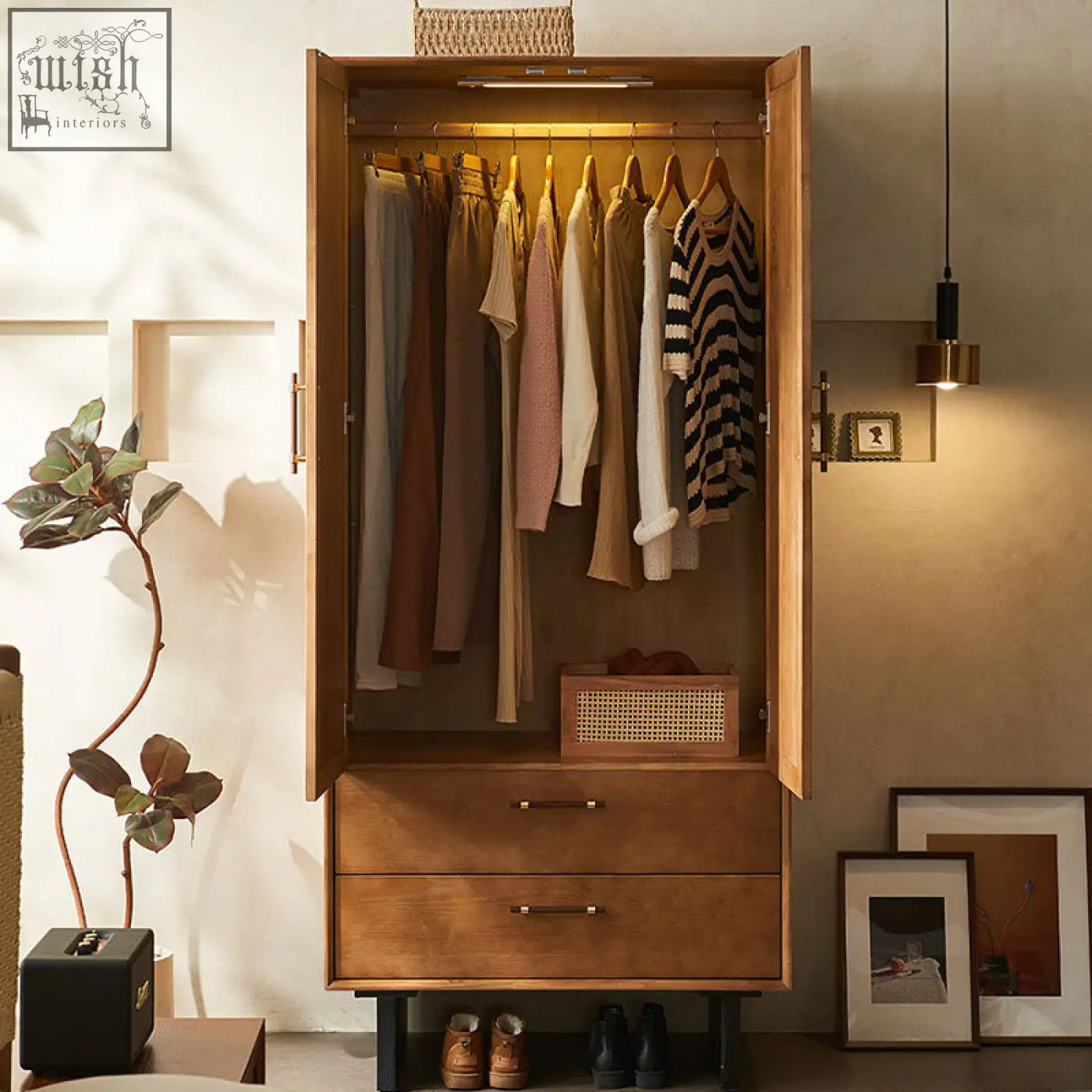 Warm-toned kaylee rattan wardrobe with two drawers and open doors showing hanging clothes in solid wood design