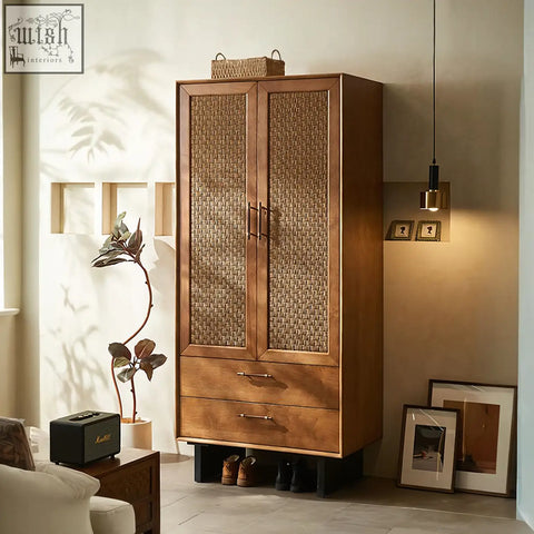 A tall kaylee rattan wardrobe in solid wood with woven rattan panels two drawers and a warm brown finish