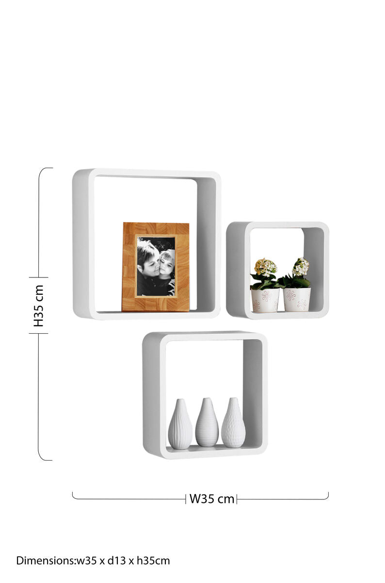 White square wall shelves with rounded edges in the kayli set of three hold decorative items for stylish storage