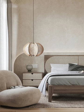 A woven spherical pendant light with a natural wood finish hanging from the ceiling called kazaru light