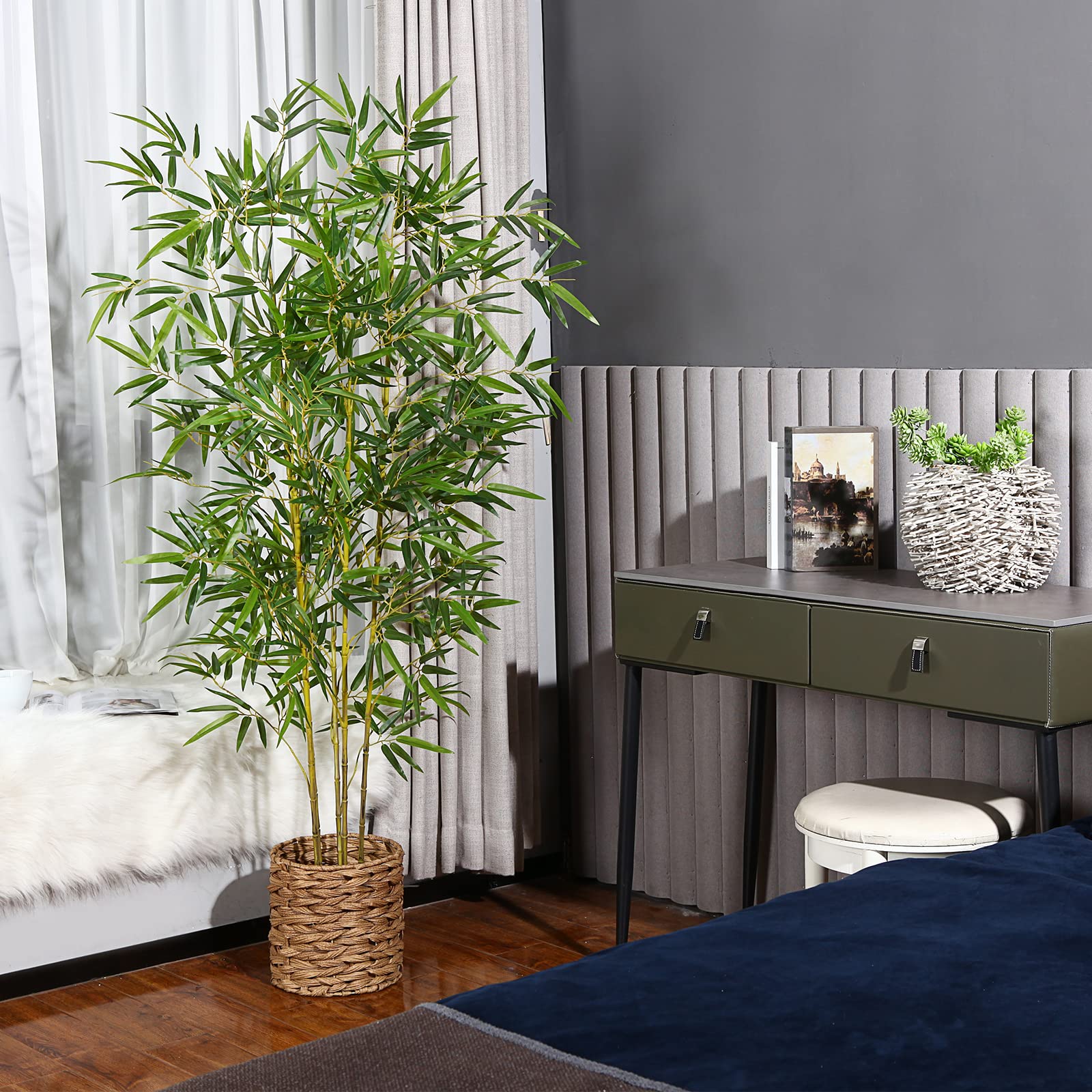 Tall green artificial bamboo tree in a woven wicker pot perfect for indoor outdoor decor and office spaces