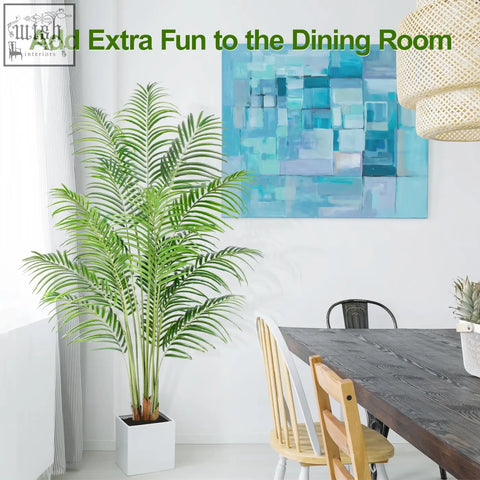 Tall green artificial palm tree in a white square pot with real bark design perfect for indoor home decor