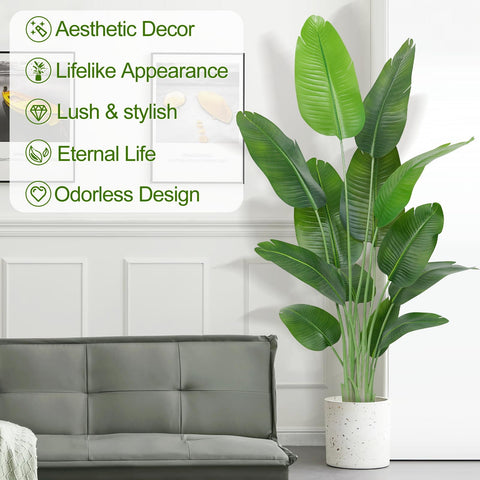 Tall lush green artificial bird of paradise plant banana tree with 13 leaves in speckled white ceramic pot for indoor use