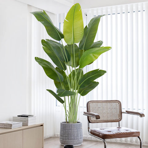 Tall artificial bird of paradise banana tree with lush green leaves in textured gray pot perfect for indoor use