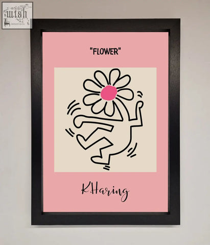 Pink framed poster featuring a keith haring flower black line drawing with pink center signed by k haring