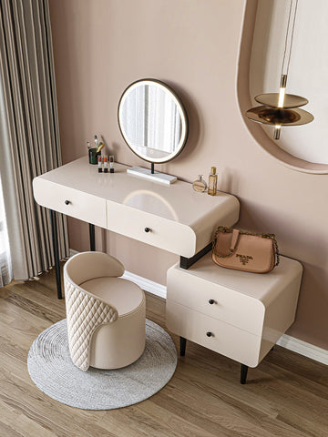 Beige quilted leather prada handbag with gold-tone chain strap on the kendall dressing table with mirror