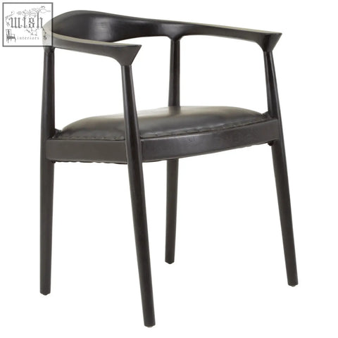 Black leather kendari black leather armchair with sleek modern design and minimalist metal frame