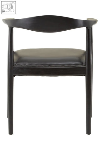 Black wooden kendari black leather chair with sleek curved backrest and dark leather upholstered seat