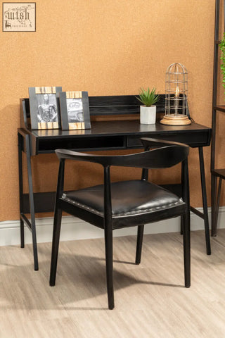 Black wooden desk with sleek minimalist design and integrated drawers paired with kendari black leather chair