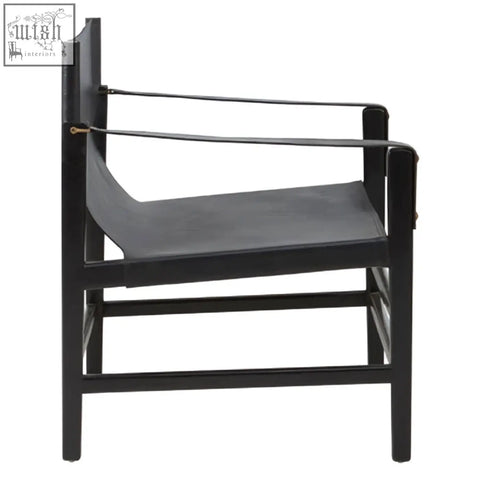 Black leather kendari armchair with sleek minimalist design and sturdy teak wood frame perfect for modern spaces