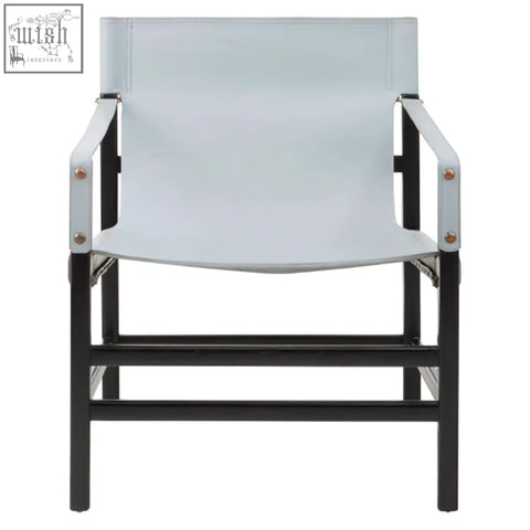 Light blue canvas chair with black metal frame and silver rivets in kendari grey leather and teak wood style