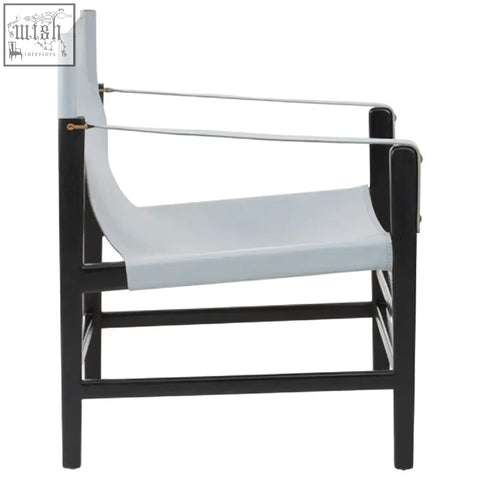 Black-framed kendari grey leather armchair with teak wood frame and silver metal accents for stylish seating
