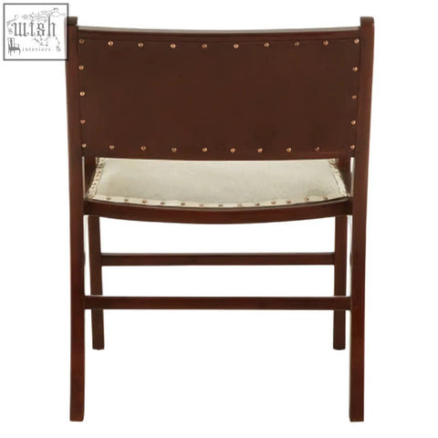 Dark brown teak wood dining chair with light beige leather upholstery and silver nailhead trim accents
