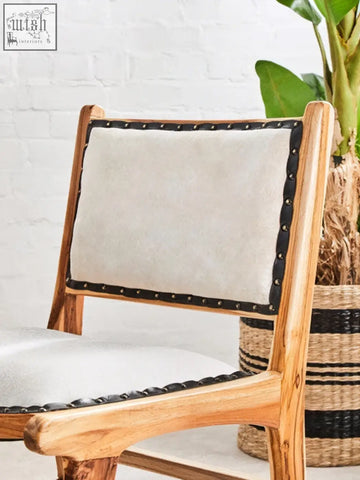 Kendari natural leather teak wood dining chair with light wood frame beige upholstery and black leather trim with brass studs