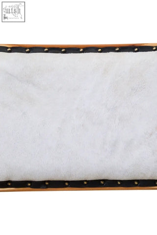 White faux fur rectangular tray with black studded edges and teak wood frame perfect for kendari natural leather dining setups