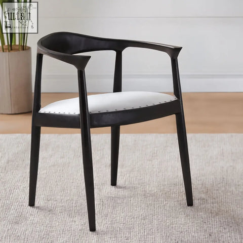 Black armchair kendari open with grey leather back and white upholstered seat featuring subtle nailhead trim