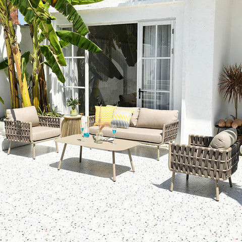 Beige woven wicker kenneth outdoor sofa set with light cushions includes sofa armchairs and coffee table in modern design