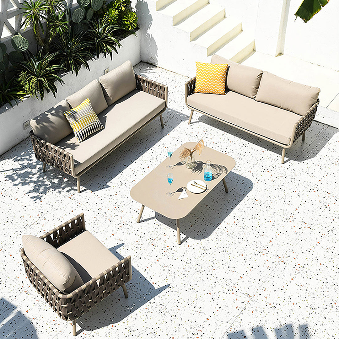 Beige woven wicker kenneth outdoor sofa set with modern geometric weave includes sofa armchairs and coffee table
