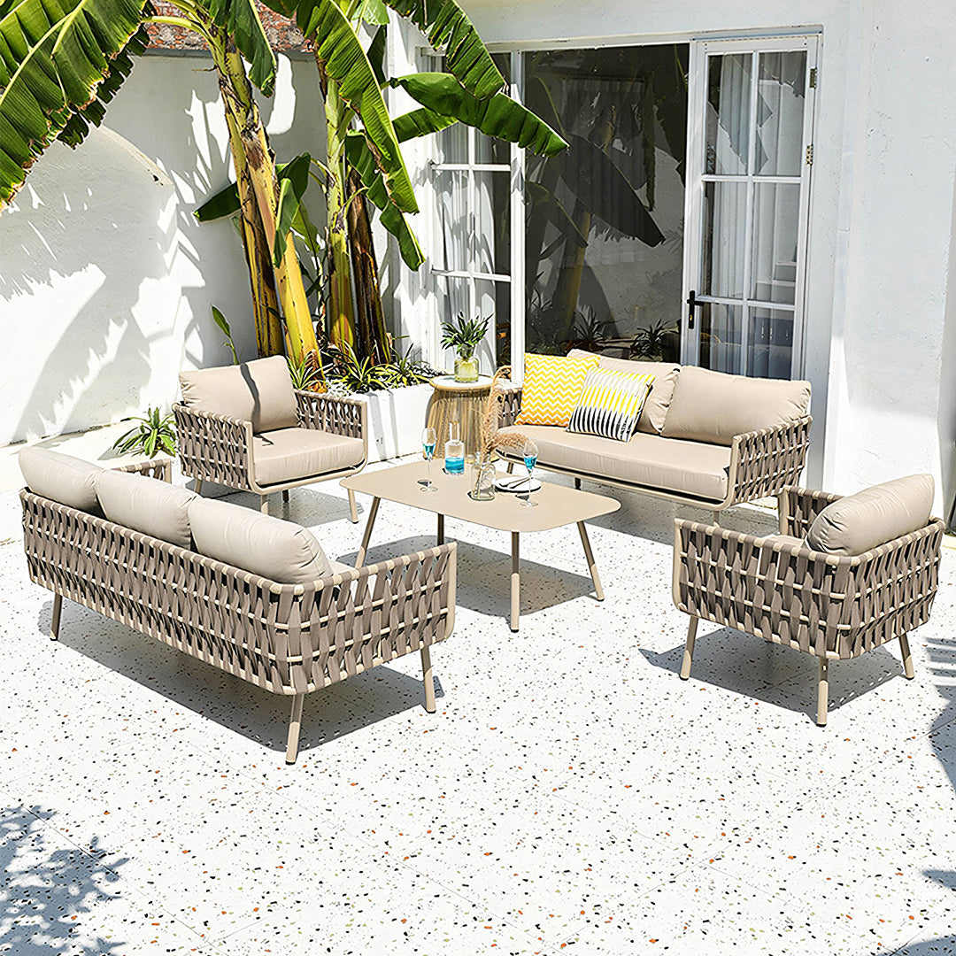 Beige woven wicker kenneth outdoor sofa set with cushions and a coffee table perfect for outdoor lounging