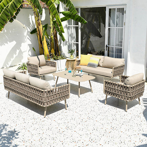 Beige woven wicker kenneth outdoor sofa set with cushions and a coffee table perfect for outdoor lounging