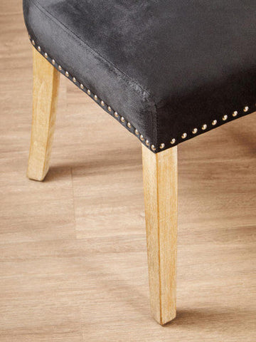 Kensington townhouse black dining chair in black velvet with light wood legs and silver nailhead trim