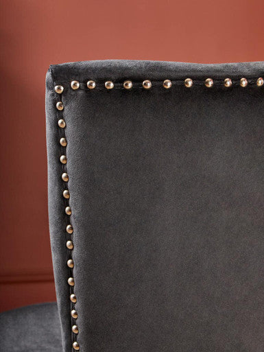 Back of kensington townhouse black winged dining chair in dark gray velvet with metallic nailhead trim