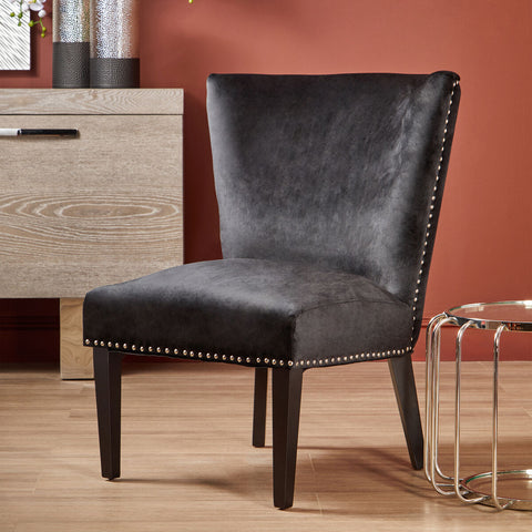 Dark gray velvet kensington townhouse black winged dining chair with silver nailhead trim along edges