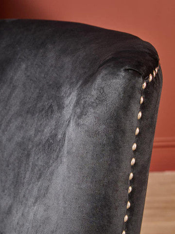 Kensington townhouse black winged dining chair in black velvet with gold toned nailhead trim along the edge