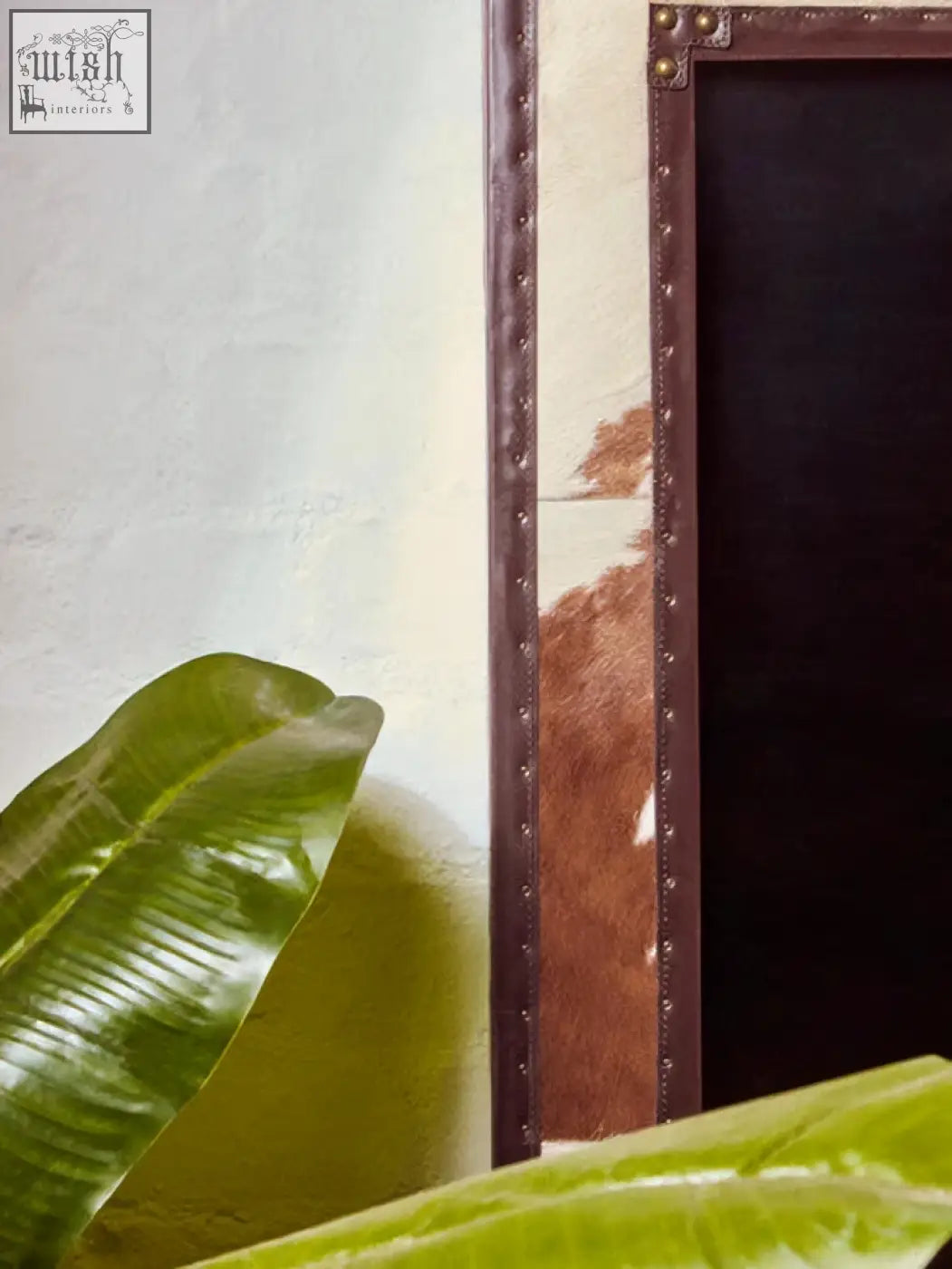 Kensington townhouse brown and white genuine cowhide wall mirror with brown leather frame and brass studs along the edge