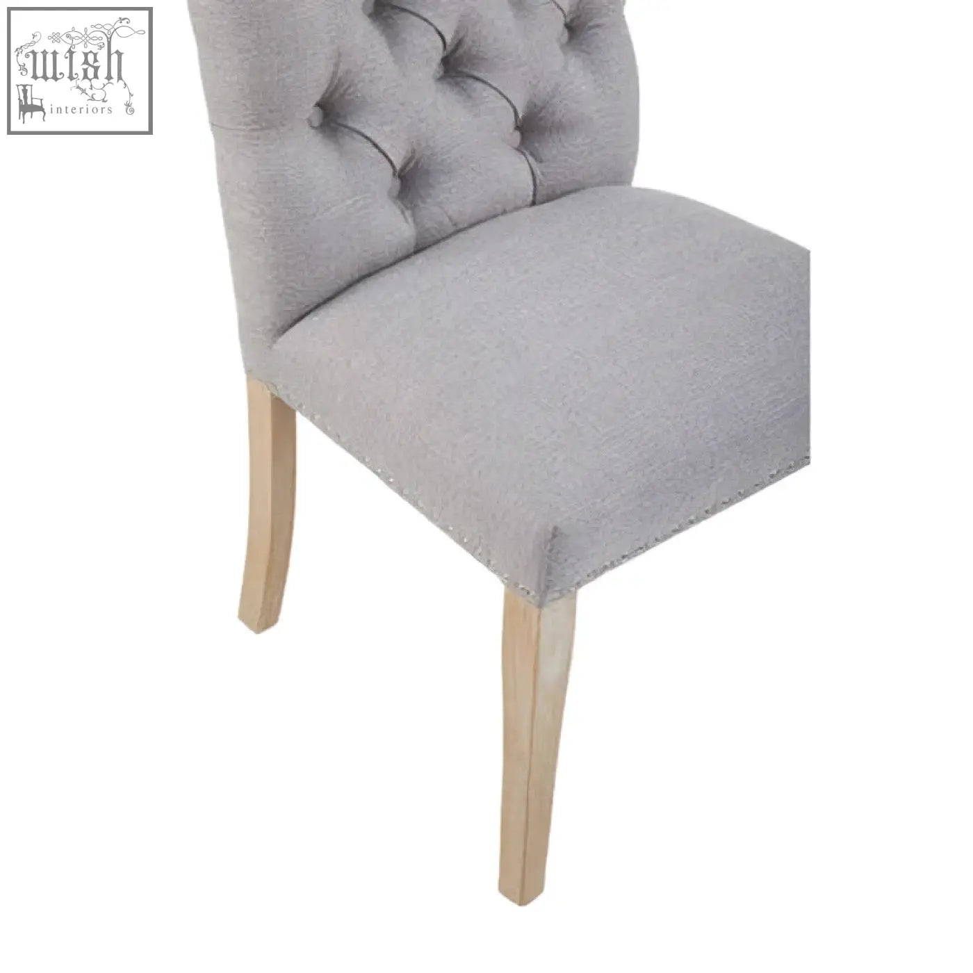 Gray tufted grey linen dining chair with light wood legs perfect for stylish linen dining setups