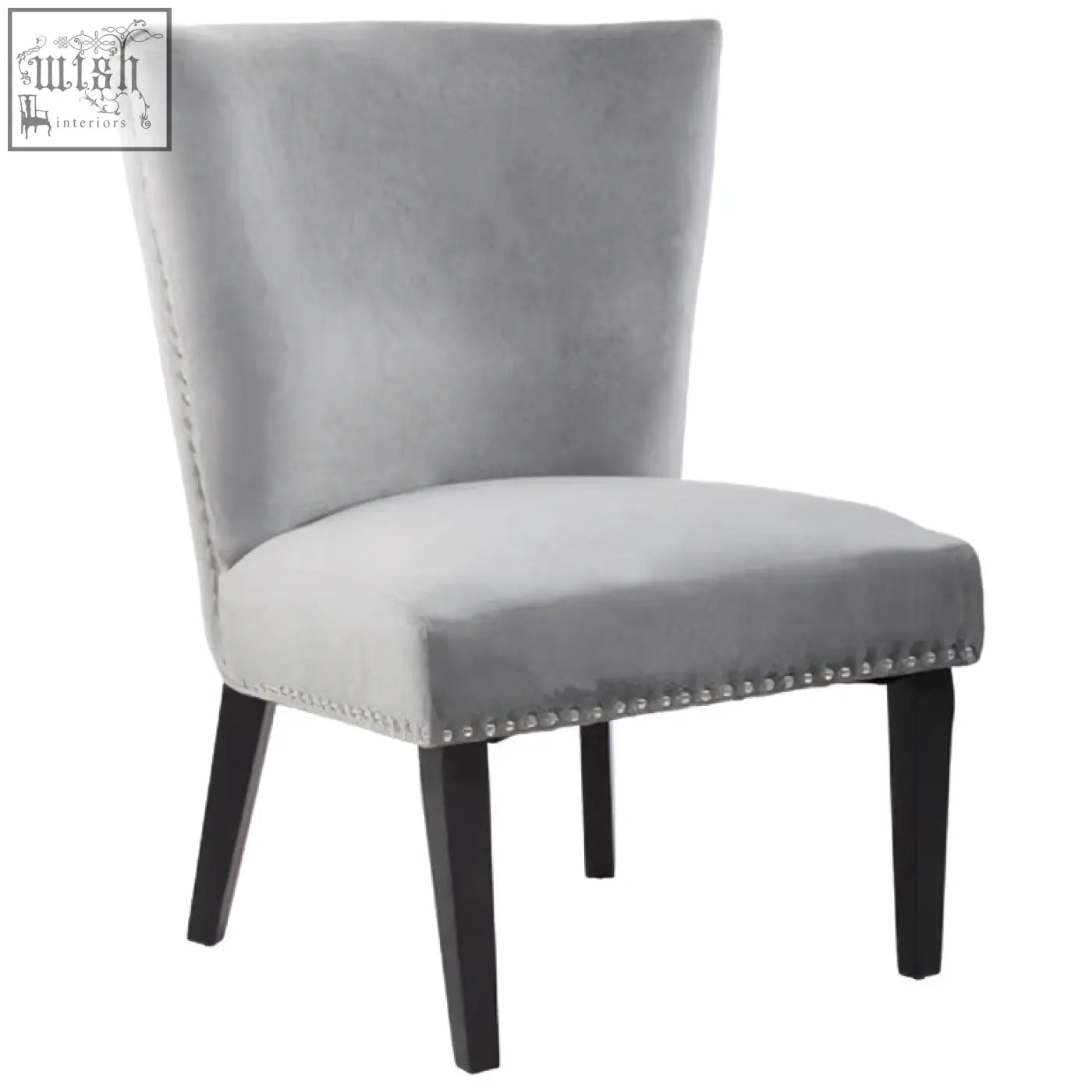 Kensington townhouse grey winged dining chair in gray velvet with black wood legs and nailhead trim along seat edge