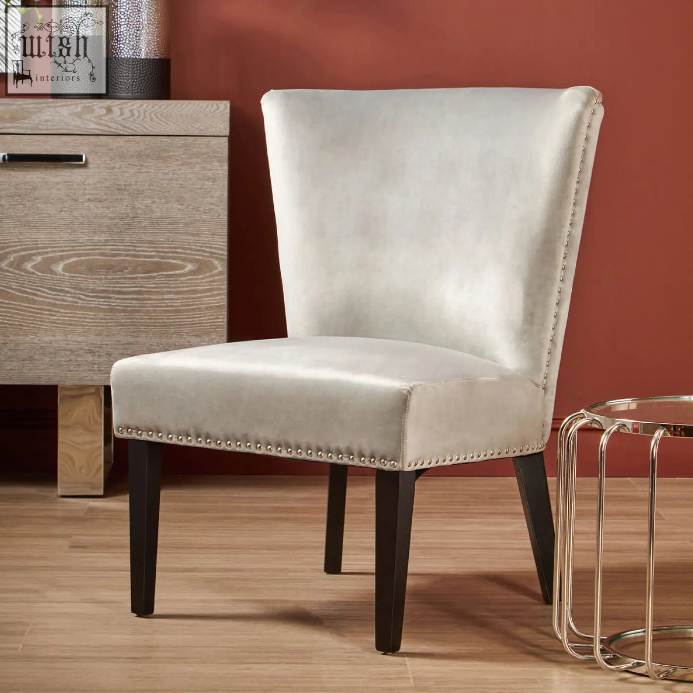 Kensington townhouse grey winged dining chair with silver-gray upholstery dark wooden legs and nailhead trim