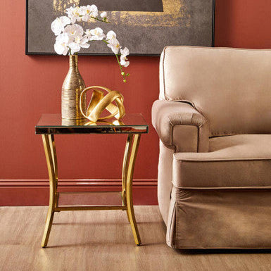 Kensington townhouse mirror side table with gold legs featuring a mirrored top and slender curved iron legs