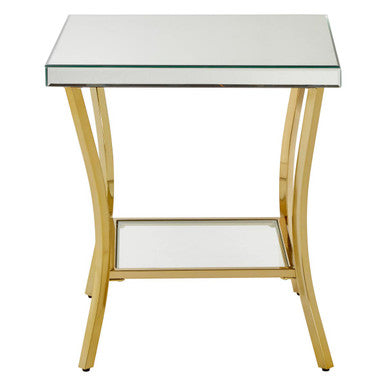 Kensington townhouse mirror side table with gold legs and curved iron legs featuring a gold metal frame and mirrored shelves