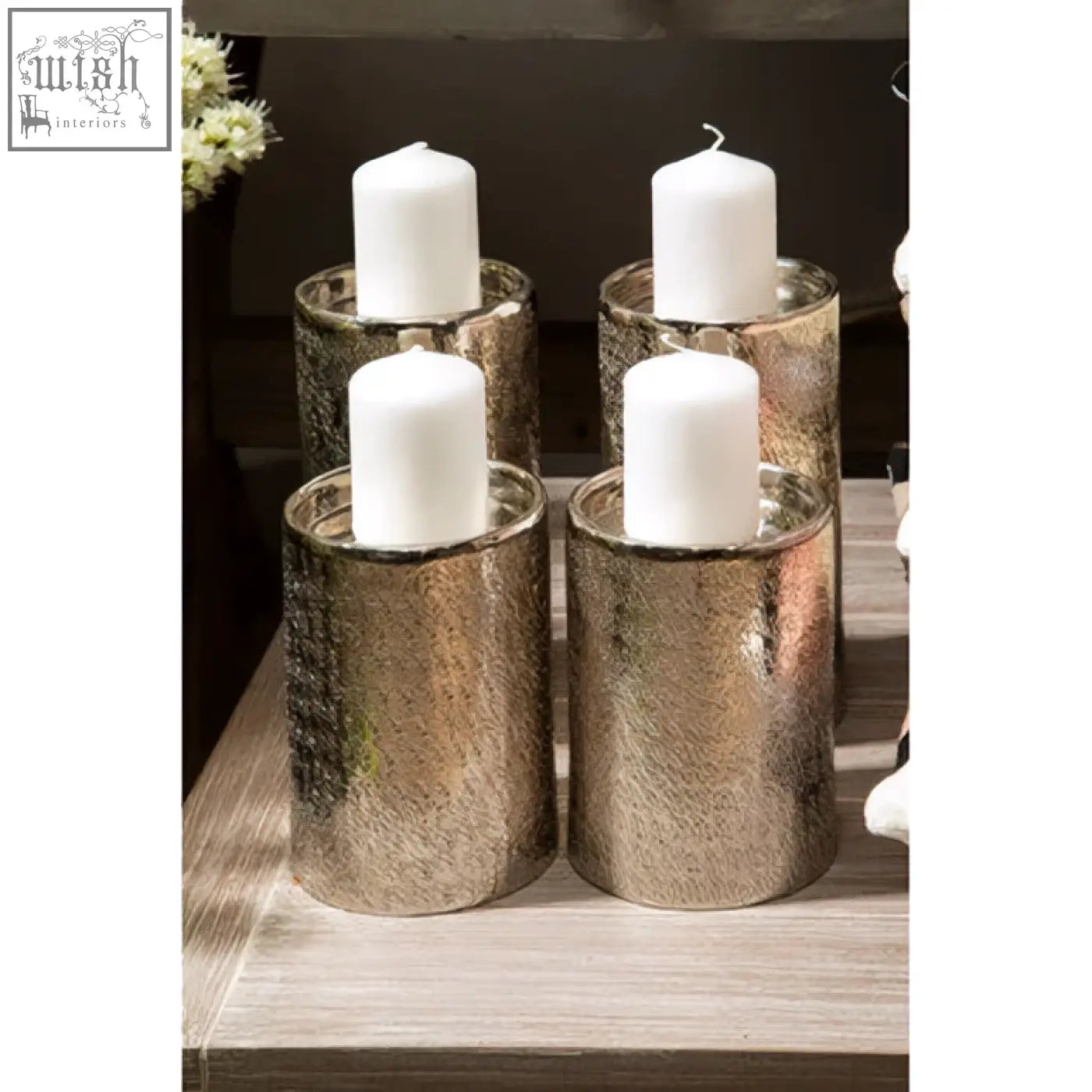 Four metallic textured silver candle holders with white candles inside kensington townhouse safia small candle holder