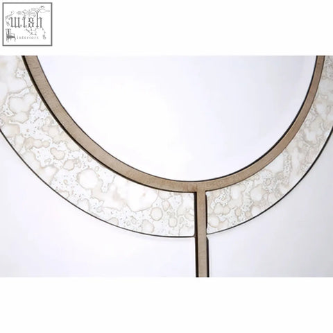 Kensington townhouse wall mirror with a silver-toned circular frame featuring an intricate lace-like pattern